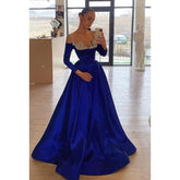 Robe de soirée trapèze glamour et spectaculaire à manches longues et bretelles en strass