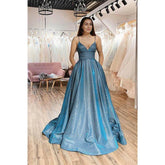 Robe de bal longue en tulle scintillant à bretelles spaghetti et poches