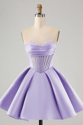 Robe de bal courte fuchsia à décolleté en A et corset en forme de cœur ornée de perles