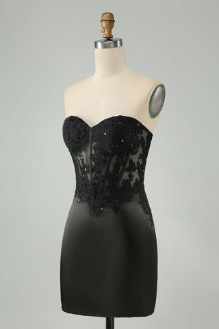 Robe de bal courte noire moulante à bustier cœur et corset ornée d'appliqués