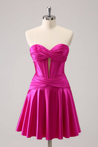 Robe de bal fuchsia ravissante, coupe trapèze, bustier croisé cœur et volants