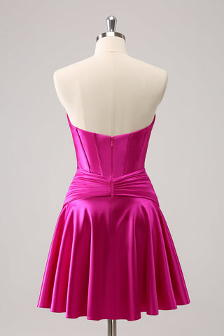 Robe de bal fuchsia ravissante, coupe trapèze, bustier croisé cœur et volants