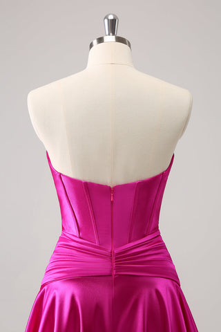 Robe de bal fuchsia ravissante, coupe trapèze, bustier croisé cœur et volants