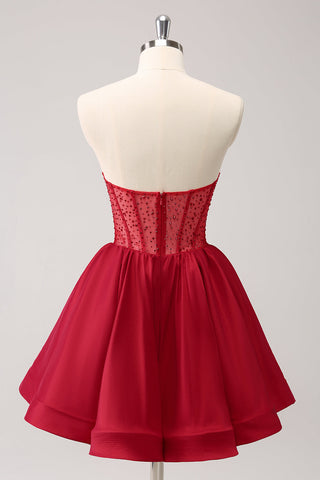 Robe de bal rouge mignonne, coupe trapèze, bustier, corset à volants et perles
