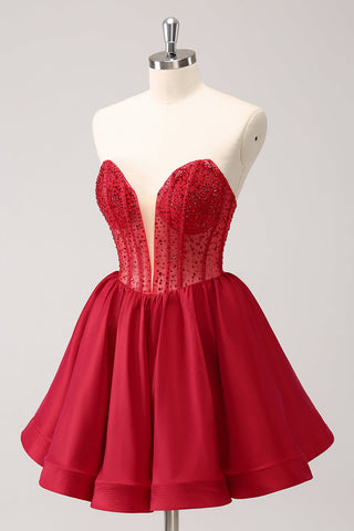 Robe de bal rouge mignonne, coupe trapèze, bustier, corset à volants et perles