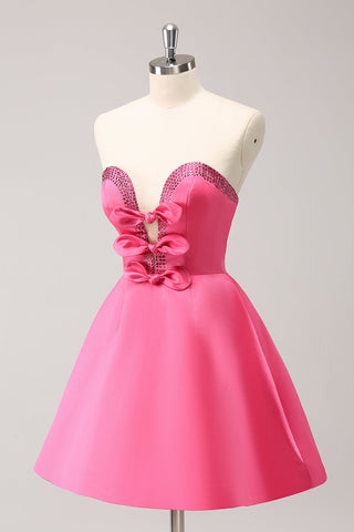 Robe de bal rose fuchsia ravissante, coupe trapèze, sans bretelles, découpée et ornée de perles