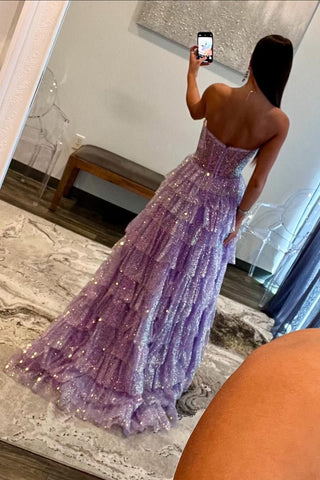 Robe de bal longue en tulle violet pailleté, décolleté cœur, bustier à volants et corset à volants