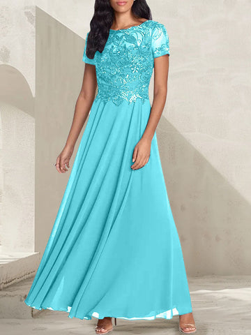 Vestido largo de corte A, color gris carbón, con escote redondo y detalles de pedrería, ideal para la madre de la novia.