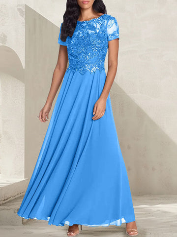 Vestido largo de corte A, color gris carbón, con escote redondo y detalles de pedrería, ideal para la madre de la novia.