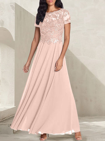 Vestido largo de corte A, color gris carbón, con escote redondo y detalles de pedrería, ideal para la madre de la novia.