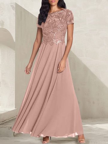 Vestido largo de corte A, color gris carbón, con escote redondo y detalles de pedrería, ideal para la madre de la novia.