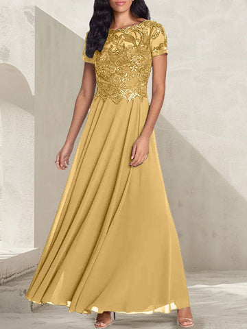 Vestido largo de corte A, color gris carbón, con escote redondo y detalles de pedrería, ideal para la madre de la novia.