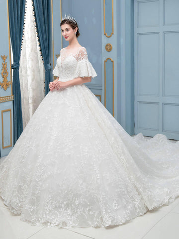 Robe de mariée longue en dentelle et perles, sans manches, longueur au sol 