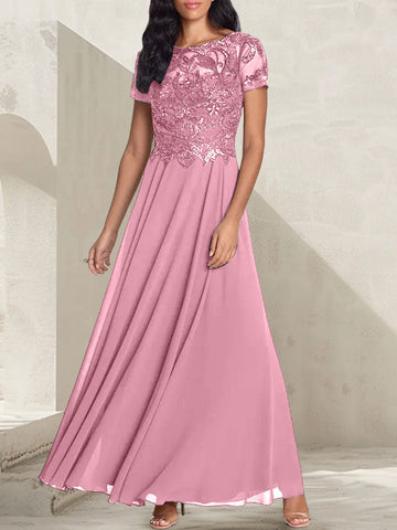 Vestido largo de corte A, color gris carbón, con escote redondo y detalles de pedrería, ideal para la madre de la novia.