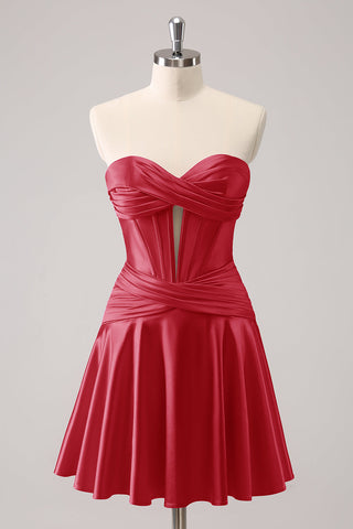 Robe de bal fuchsia ravissante, coupe trapèze, bustier croisé cœur et volants