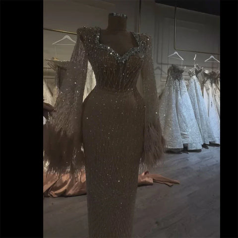 2025 Arabic Nude Beaded Evening Gown With Feather Cuffs and Long Sleeves for Formal Occasion LA72892