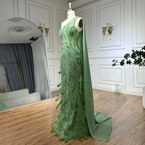 2025 Arabic Green One Shoulder Beaded Feathers Luxury Evening Gowns with Side Cape Shawl for Women's Party LA72698