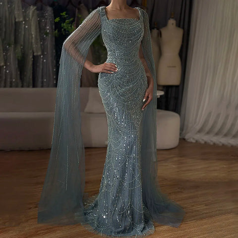2025 Saudi Arabic Turquoise Mermaid Evening Dress With Pearls Beaded Cape Sleeves For Formal Occasion LA72590A