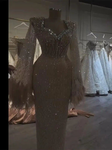 2025 Arabic Nude Beaded Evening Gown With Feather Cuffs and Long Sleeves for Formal Occasion LA72892