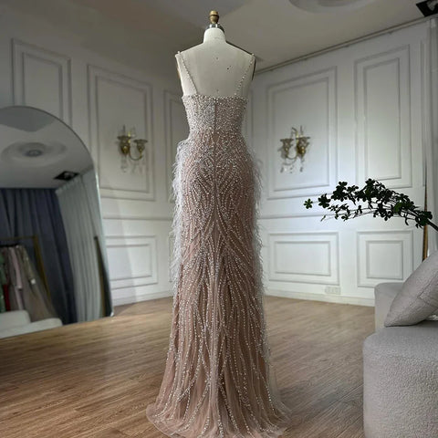 2025 Arabic White Nude Spaghetti Strap Feathers Beaded Mermaid Evening Gown for Formal Occasion LA72823