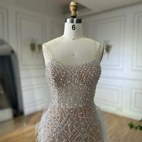 2025 Arabic White Nude Spaghetti Strap Feathers Beaded Mermaid Evening Gown for Formal Occasion LA72823