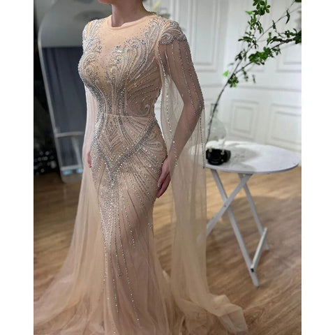 Vestidos de noche elegantes con cuentas, estilo sirena, color nude, con mangas tipo capa, de inspiración árabe. Vestidos de lujo para mujer, ideales para bodas y fiestas. Colección 2025. LA72165 