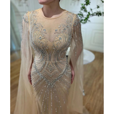 Vestidos de noche elegantes con cuentas, estilo sirena, color nude, con mangas tipo capa, de inspiración árabe. Vestidos de lujo para mujer, ideales para bodas y fiestas. Colección 2025. LA72165 