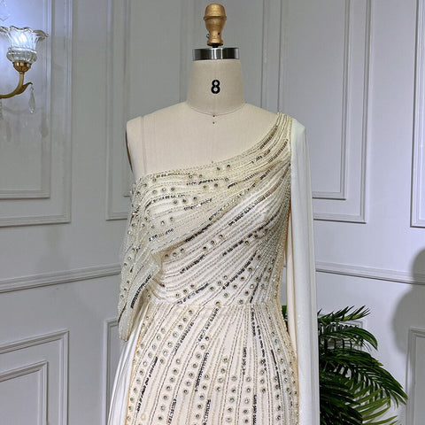 Vestido de noche de lujo, elegante, de sirena, con un solo hombro, manga tipo capa, color beige, con cuentas, estilo 2025, para mujer, ideal para fiestas (LA71694) 