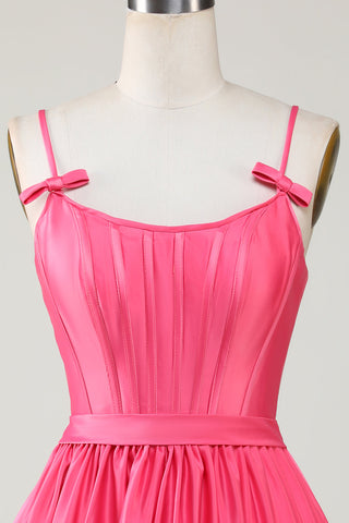 Robe de bal fuchsia mignonne, coupe trapèze, bretelles spaghetti, corset, volants et nœuds