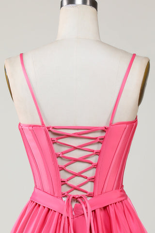 Robe de bal fuchsia mignonne, coupe trapèze, bretelles spaghetti, corset, volants et nœuds