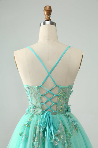 Robe de bal courte verte à bretelles spaghetti et corset ornée d'appliqués