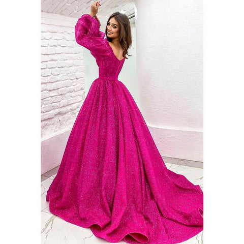 Robe de bal fuchsia scintillante à manches longues et coupe trapèze avec poches 