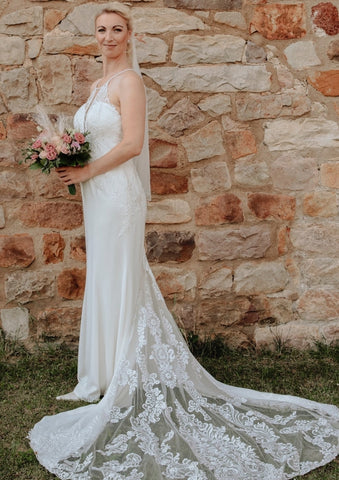 Elegant Long White Mermaid Sleeveless Lace Backless Wedding Dress with Train