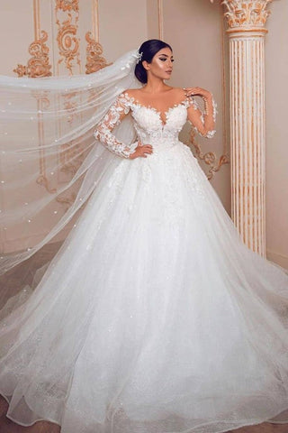 Robe de mariée longue et sobre de style princesse, en tulle et dentelle, avec manches