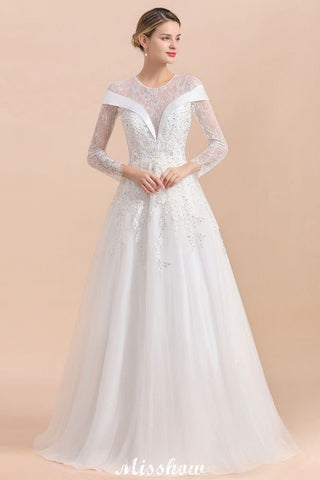 Vestido de novia sencillo con apliques de cuentas blancas, manga larga y largo hasta el suelo.